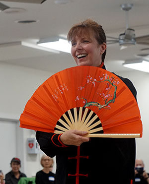 Janet DeFeo with tai chi fan